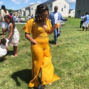 A gold two piece shirt and pants